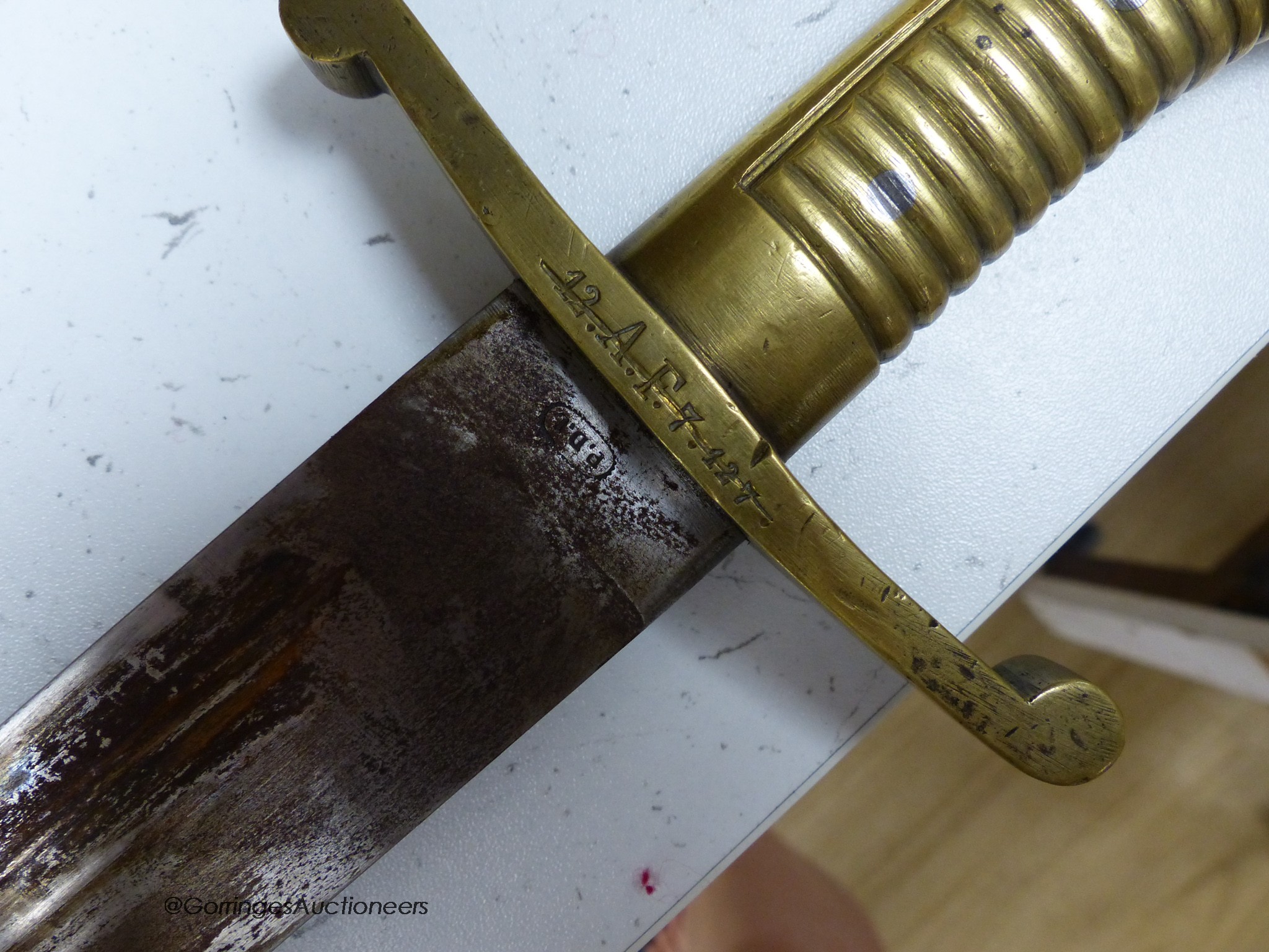 A French short sword and sheath, both marked 12.A.F.7.127